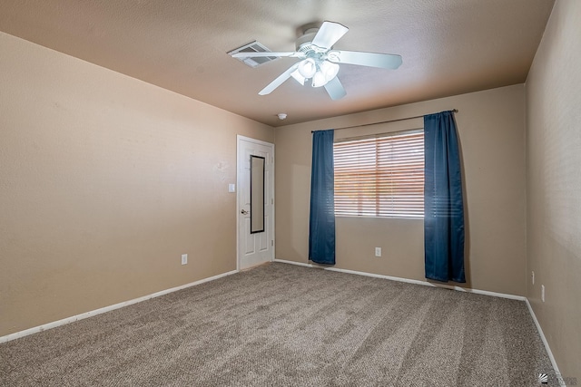 unfurnished room with baseboards, ceiling fan, and carpet flooring