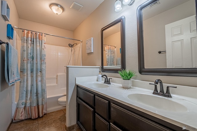 full bathroom featuring shower / bathtub combination with curtain, vanity, tile patterned floors, and toilet