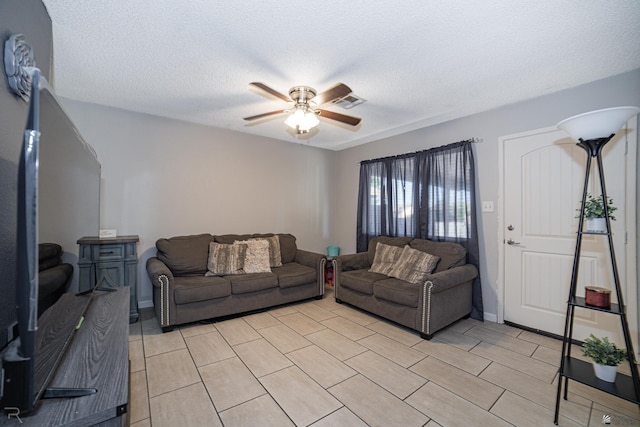 3168 W 31st Ln, Yuma, AZ 85364 - living area featuring a ceiling fan, a textured ceiling, and light tile patterned flooring