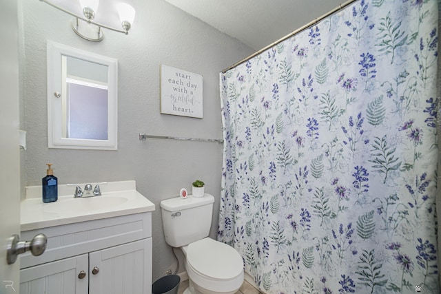3168 W 31st Ln, Yuma, AZ 85364 - full bathroom featuring vanity, toilet, a shower with shower curtain, and a textured wall