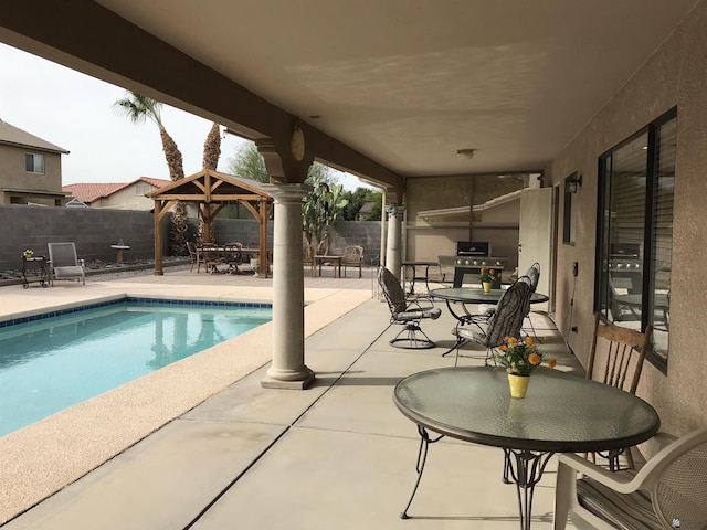 11551 E Via Salida, Yuma, AZ 85367 - view of pool with outdoor dining area, a gazebo, a fenced in pool, a fenced backyard, and a patio
