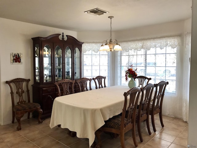 11551 E Via Salida, Yuma, AZ 85367 - dining space featuring visible vents, light tile patterned flooring, and an inviting chandelier