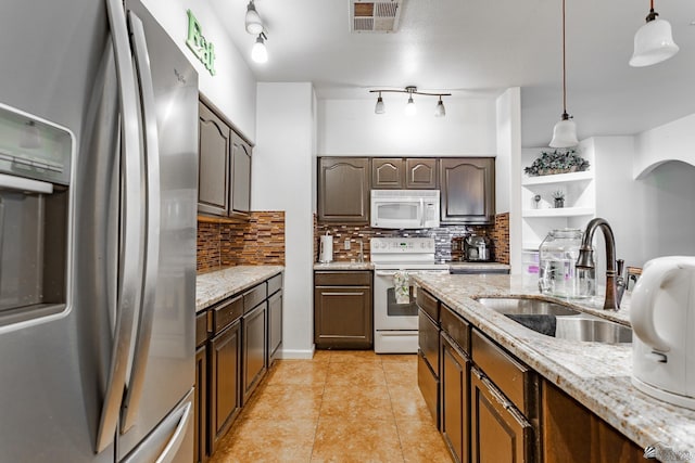 184 E Nancy St, San Luis, AZ 85336 - kitchen featuring white appliances, backsplash, pendant lighting, light tile patterned floors, and light stone countertops