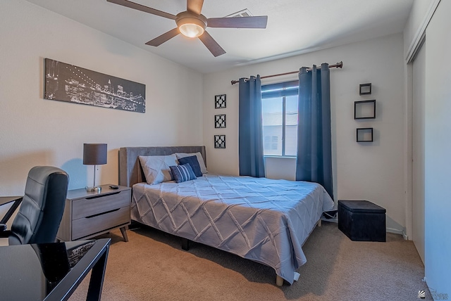 bedroom with carpet floors, ceiling fan, and visible vents