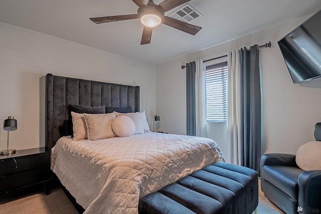 bedroom with carpet flooring, ceiling fan, and visible vents