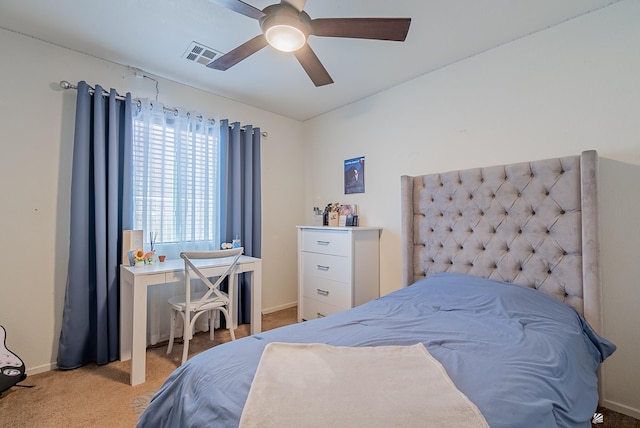 carpeted bedroom featuring a ceiling fan, baseboards, and visible vents