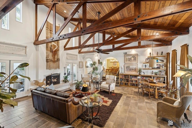 1925 S Ridgeview Dr, Yuma, AZ 85364 - living area with wood ceiling, ceiling fan, a lit fireplace, beam ceiling, and high vaulted ceiling