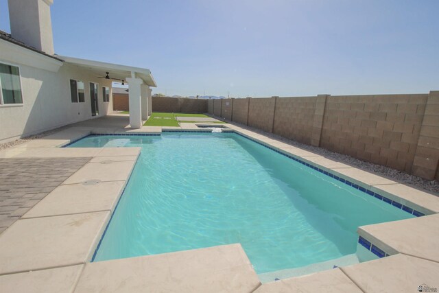 view of swimming pool featuring a patio, a fenced in pool, and a fenced backyard