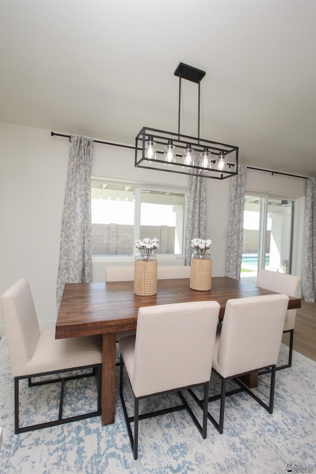 dining area featuring light wood-style floors