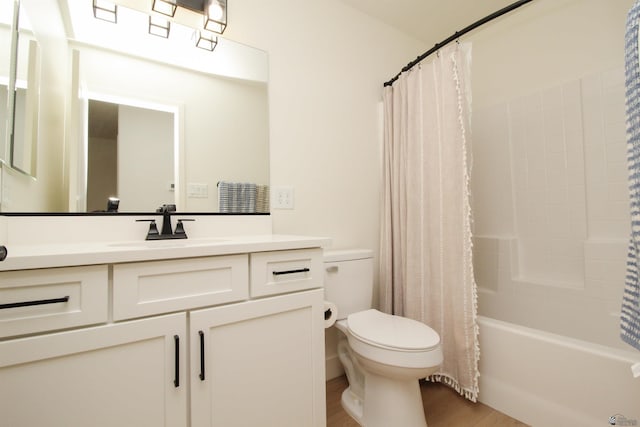 full bathroom with vanity, shower / bath combo with shower curtain, toilet, and wood finished floors