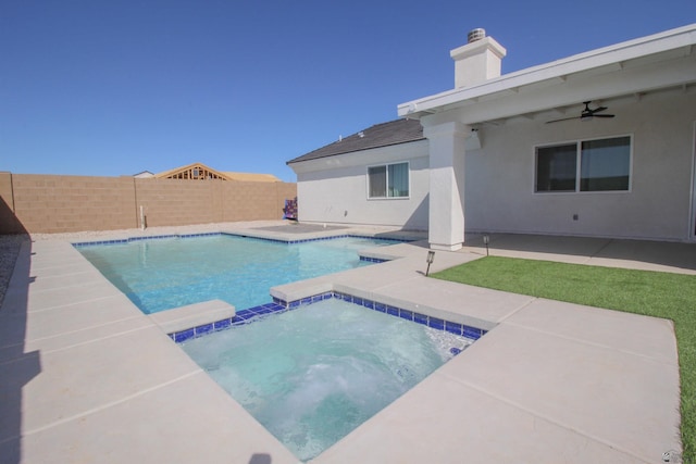 view of swimming pool featuring a patio, a fenced backyard, a ceiling fan, and a pool with connected hot tub