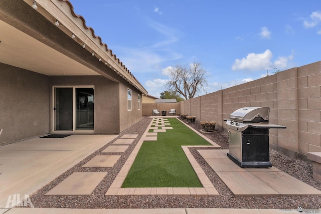 view of yard featuring a patio and a fenced backyard