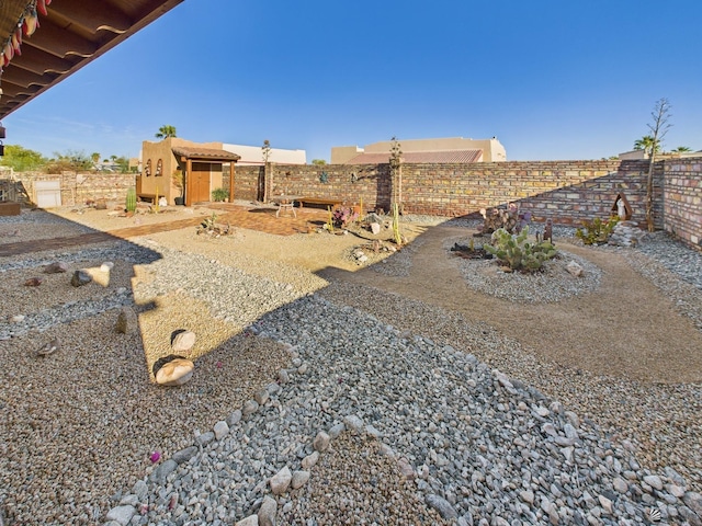 14340 E 49th Ln, Yuma, AZ 85367 - view of yard with a storage unit, fence, and an outbuilding