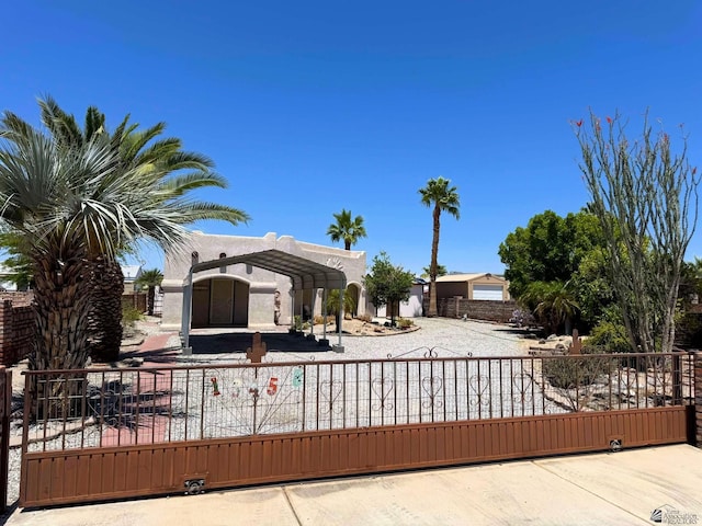 13458 E 53rd Ln, Yuma, AZ 85367 - view of front of house featuring a gate, fence private yard, a carport, and stucco siding