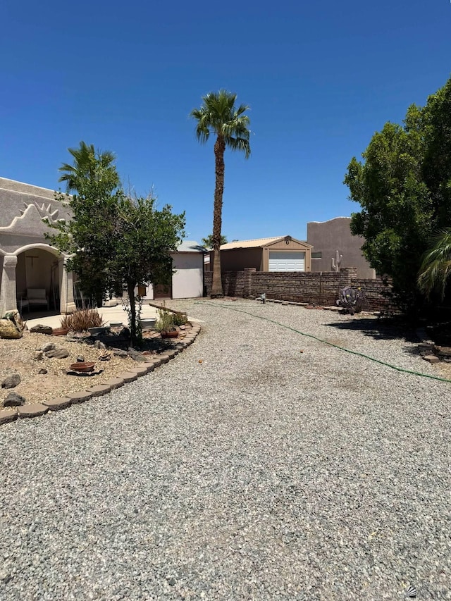 13458 E 53rd Ln, Yuma, AZ 85367 - view of front of house featuring stucco siding and gravel driveway