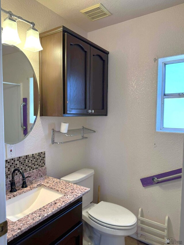13458 E 53rd Ln, Yuma, AZ 85367 - bathroom featuring vanity and backsplash