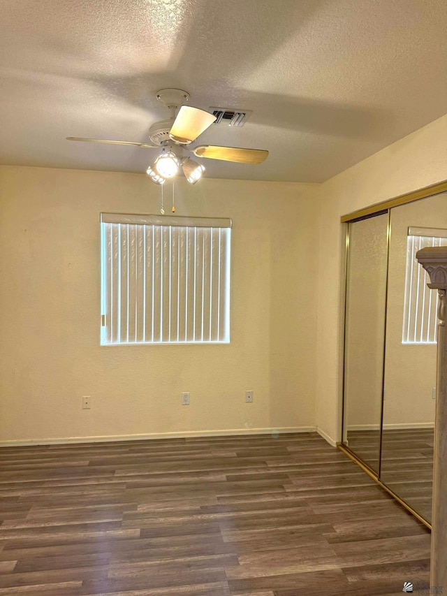 13458 E 53rd Ln, Yuma, AZ 85367 - unfurnished bedroom featuring a textured ceiling, wood finished floors, a closet, and a ceiling fan