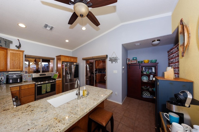 13220 E 55th St, Yuma, AZ 85367 - kitchen featuring visible vents, lofted ceiling, ceiling fan, a sink, and stainless steel appliances