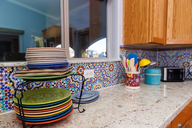 13220 E 55th St, Yuma, AZ 85367 - interior details featuring light stone counters and decorative backsplash