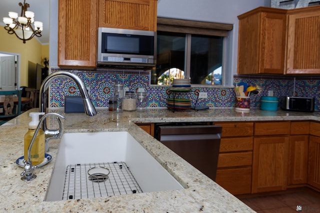 13220 E 55th St, Yuma, AZ 85367 - kitchen with stainless steel appliances, light stone countertops, and decorative backsplash