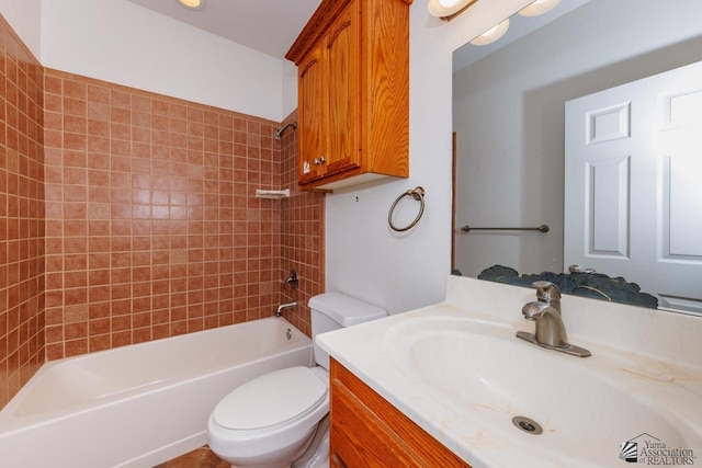 bathroom featuring vanity,  shower combination, and toilet