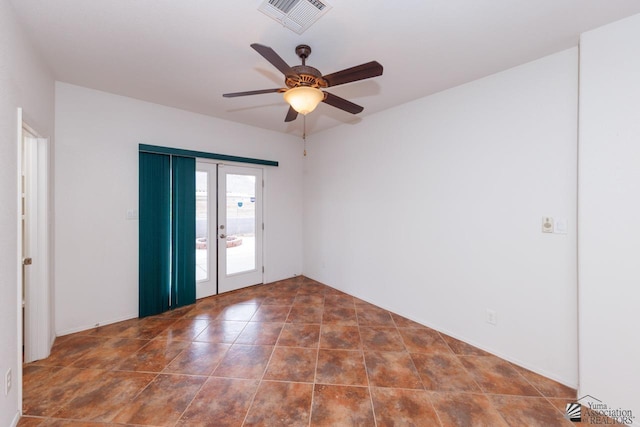 empty room with visible vents, ceiling fan, and french doors