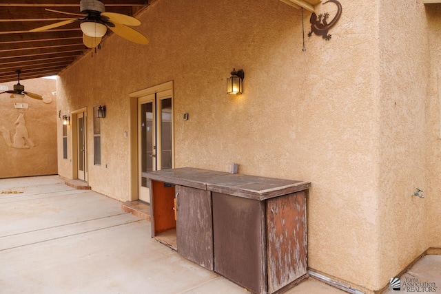 view of patio / terrace featuring ceiling fan