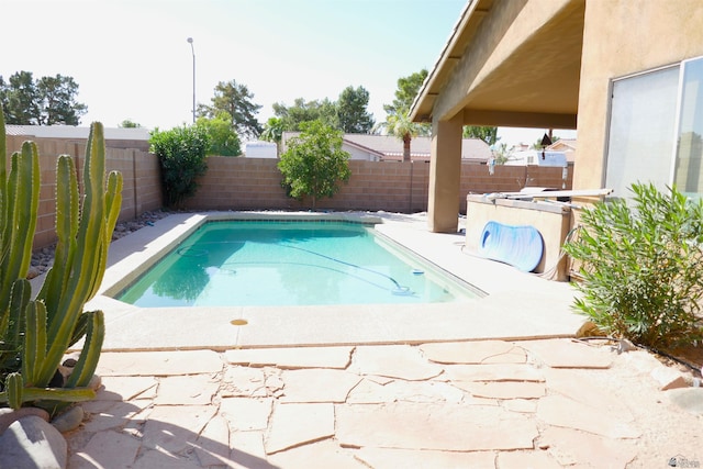 view of pool featuring a patio