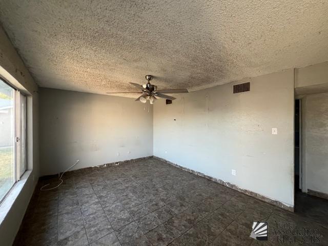 2232 W 19th St, Yuma, AZ 85364 - spare room featuring a ceiling fan and a textured ceiling