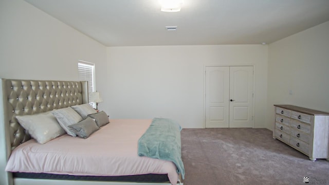 carpeted bedroom with visible vents