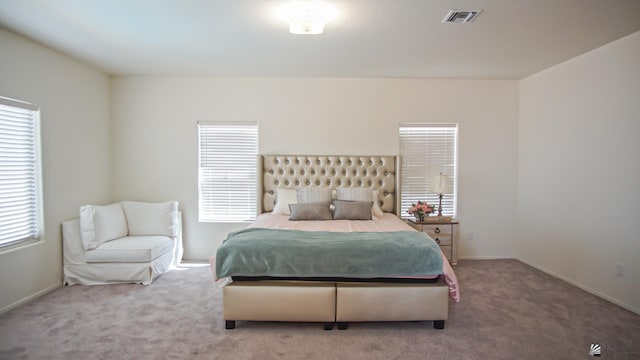 bedroom featuring carpet, visible vents, and baseboards