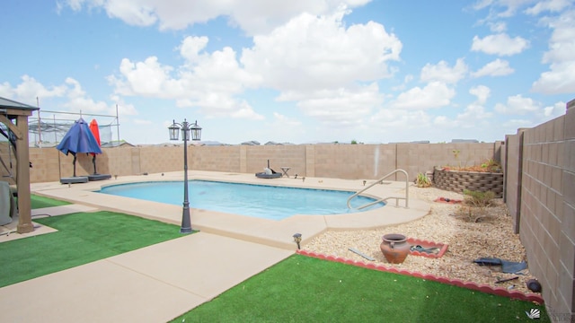 view of pool featuring a patio area, a fenced backyard, and a fenced in pool