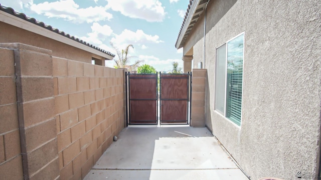 view of gate with fence