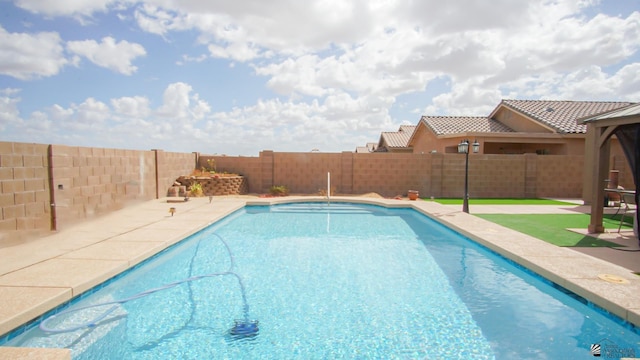 view of pool featuring a patio, a fenced backyard, and a fenced in pool