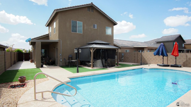 view of swimming pool featuring a patio area, a fenced in pool, a gazebo, and a fenced backyard