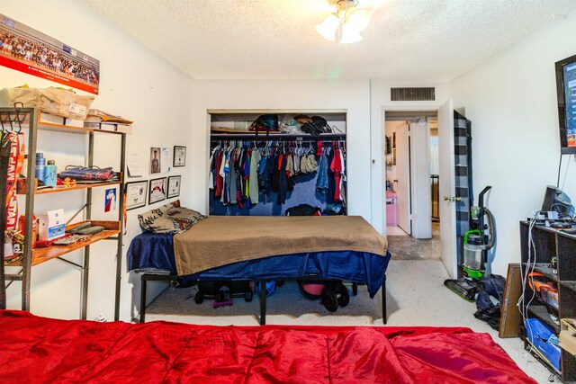 1836 W Allen St, Yuma, AZ 85364 - bedroom with a textured ceiling, a closet, and carpet