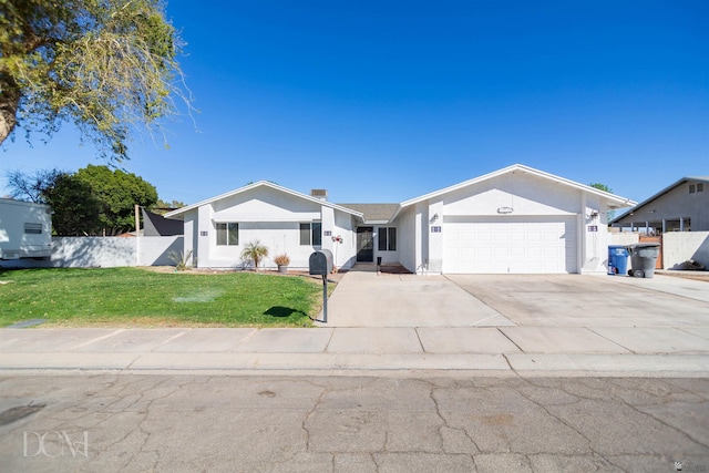 single story home with an attached garage, fence, a front yard, and stucco siding