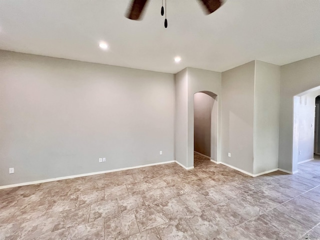 3431 W 39th Pl, Yuma, AZ 85365 - unfurnished room featuring arched walkways, a ceiling fan, baseboards, and recessed lighting