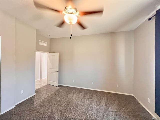 3431 W 39th Pl, Yuma, AZ 85365 - unfurnished room with ceiling fan, dark colored carpet, and baseboards