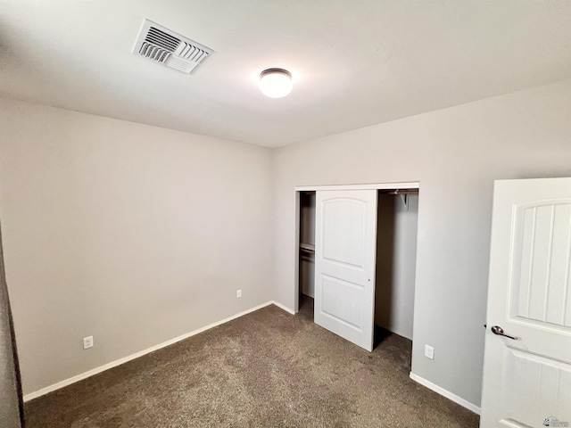 3431 W 39th Pl, Yuma, AZ 85365 - unfurnished bedroom with dark carpet, a closet, and baseboards