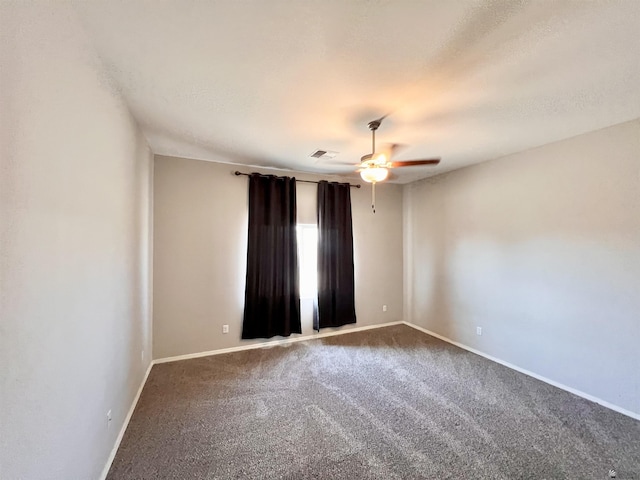 3431 W 39th Pl, Yuma, AZ 85365 - spare room featuring carpet flooring, a ceiling fan, and baseboards