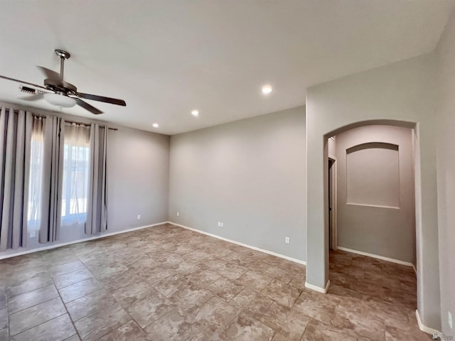 3431 W 39th Pl, Yuma, AZ 85365 - unfurnished room with arched walkways, a ceiling fan, recessed lighting, and baseboards