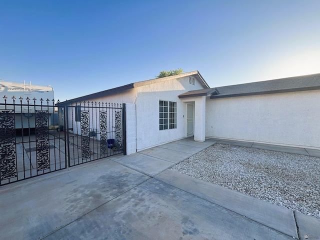 161 Las Praderas St, San Luis, AZ 85336 - exterior space featuring fence, a gate, and stucco siding