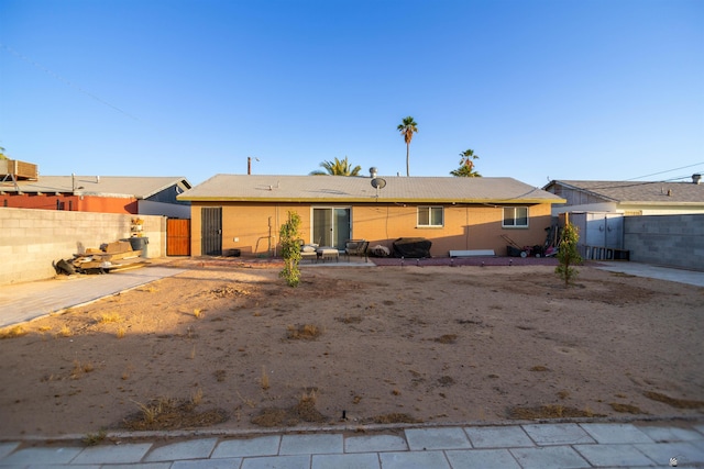 1180 E 26th Pl, Yuma, AZ 85365 - back of house featuring a patio area and a gate
