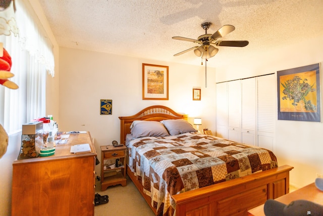1180 E 26th Pl, Yuma, AZ 85365 - bedroom with a textured ceiling, a closet, a ceiling fan, and light carpet