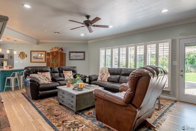 living area with light wood-style floors, ceiling fan, recessed lighting, and visible vents