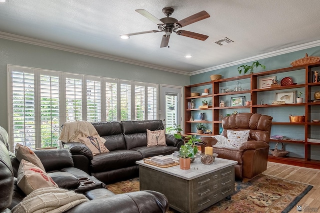 living room featuring a ceiling fan, visible vents, crown molding, wood finished floors, and recessed lighting
