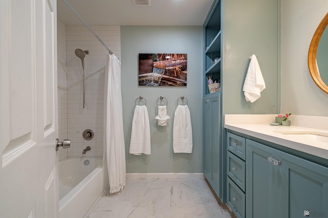 full bath with vanity, shower / bath combo, marble finish floor, and visible vents