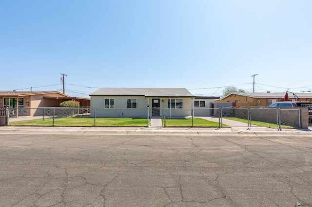 single story home featuring a front lawn, a fenced front yard, a gate, and stucco siding