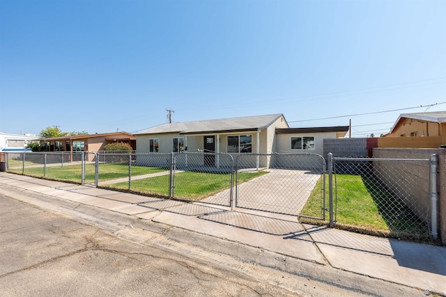 ranch-style house featuring a gate, a front lawn, a fenced front yard, and stucco siding
